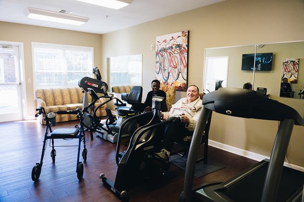 Residents exercising in the fitness room
