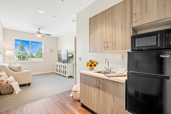 Cozy interior of a resident's room with kitchenette