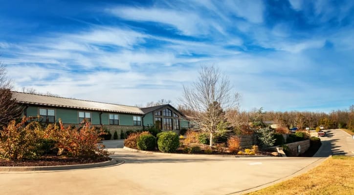 Exterior view of the facility with landscaped entrance