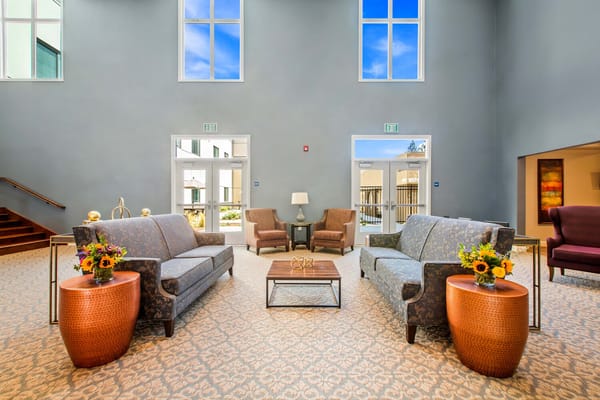 Interior common area with seating and natural light