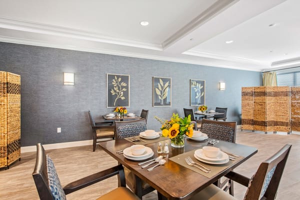 Well-decorated dining room with tables set for meals