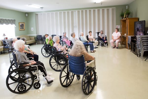 Residents participating in a group activity in a common area