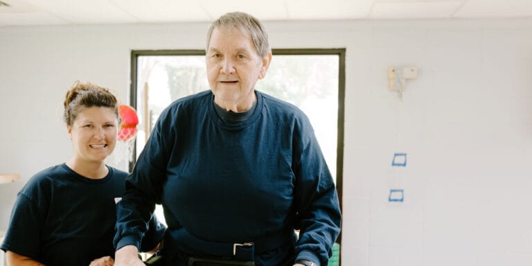 Staff assisting a resident during a therapeutic session