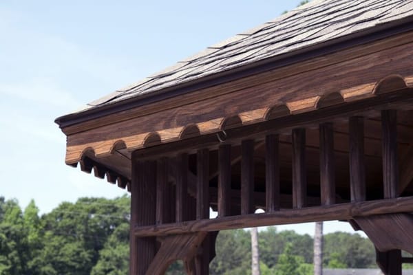 Close-up of a wooden gazebo roof on a sunny day