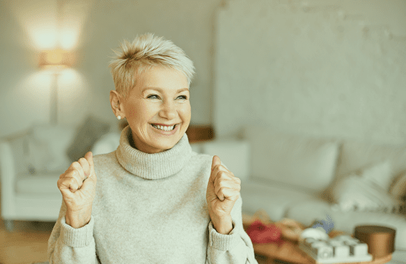 Smiling senior woman in a cozy interior setting