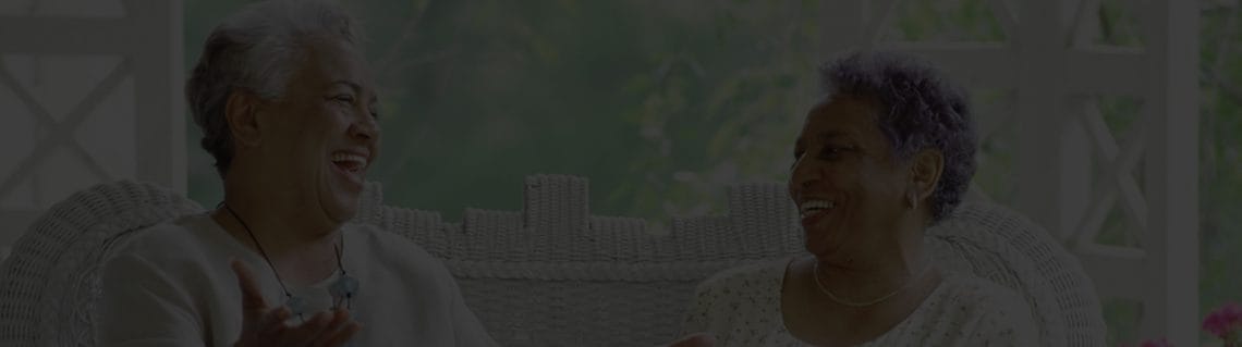 Two residents enjoying a lighthearted conversation