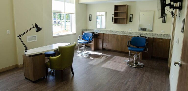 Bright interior view of a salon area with stylist chairs
