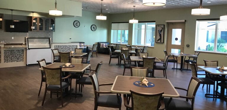 Bright and spacious dining area with tables and chairs