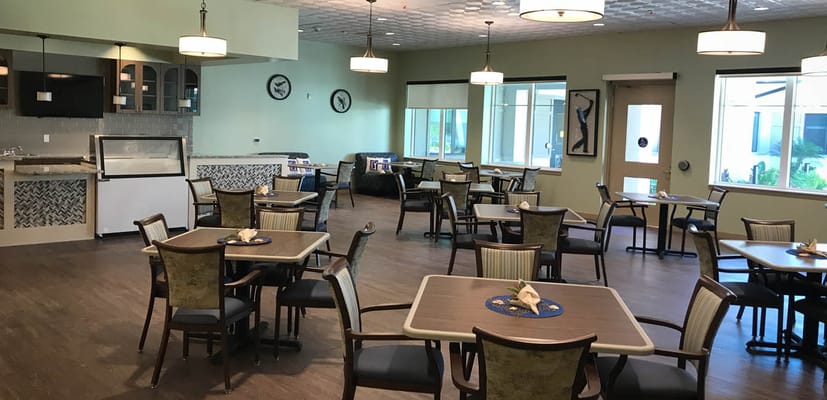 Bright and spacious dining area with tables and chairs