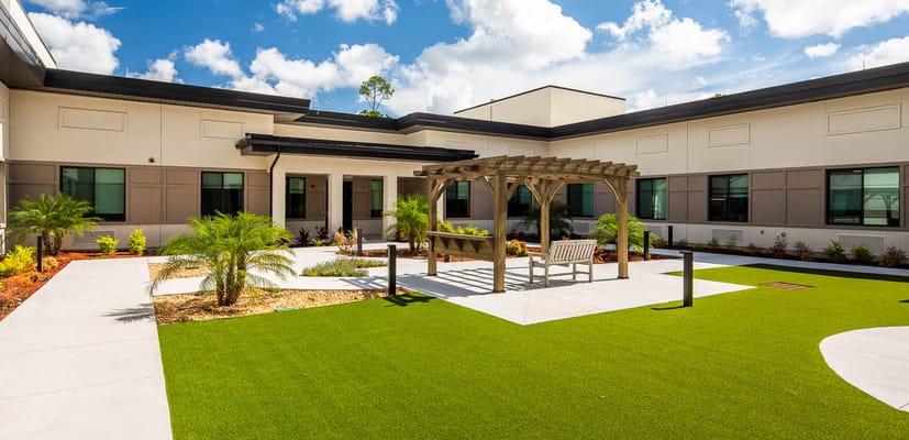 Outdoor courtyard with seating area and landscaping