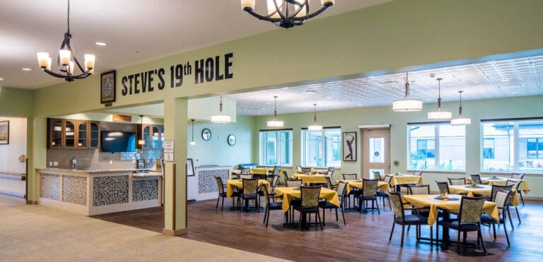 Dining area with tables and chairs in a colorful setting