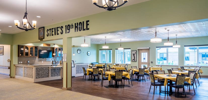 Dining area with tables and chairs in a colorful setting