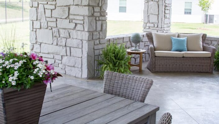 Outdoor seating area with flowers and plants