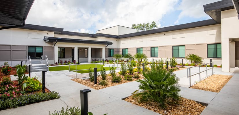 Garden courtyard with accessible pathways and landscaping