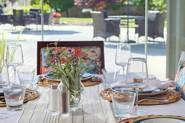 A beautifully set dining table with outdoor view