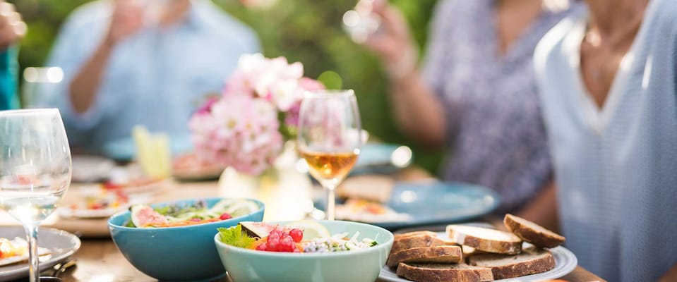 Beautiful outdoor dining setup with food and drinks