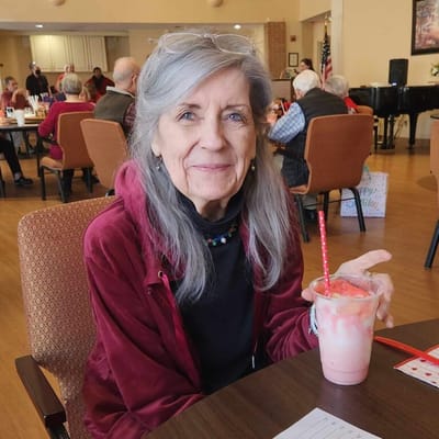 Resident enjoying a drink in a common area