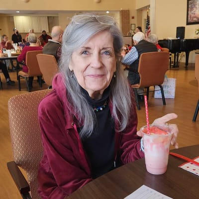 Resident enjoying a drink in a common area