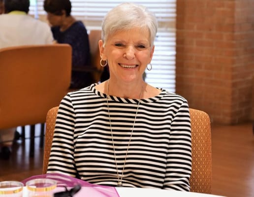 A smiling resident in a common area.