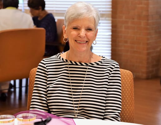 A smiling resident in a common area.