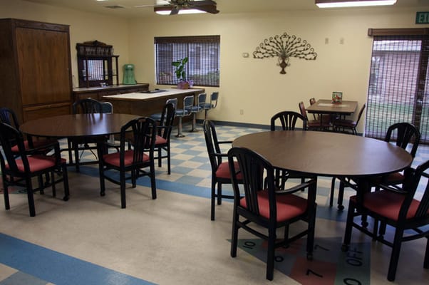 Dining area with tables and chairs in the facility