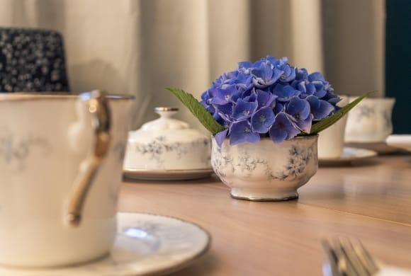 A beautifully arranged table setting with flowers