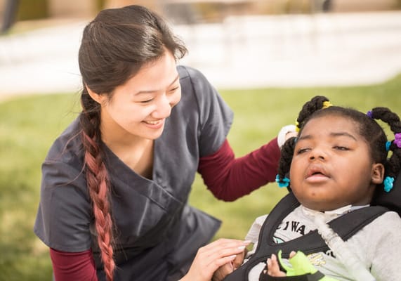 Staff member engaging with a resident outdoors