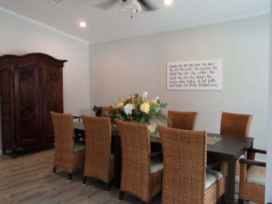 Dining room with large table and floral centerpiece