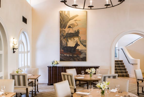 Elegant dining room with tables and a painting