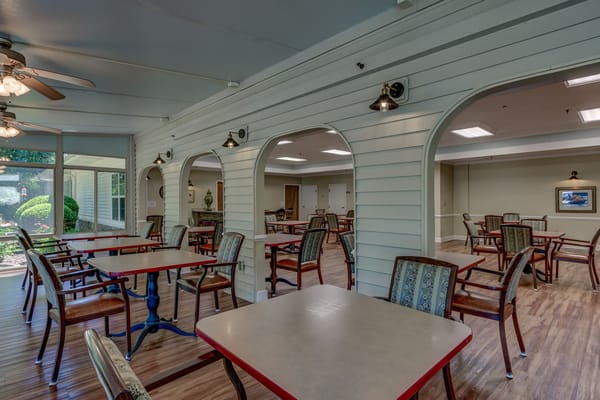 Interior view of a common area with tables and chairs