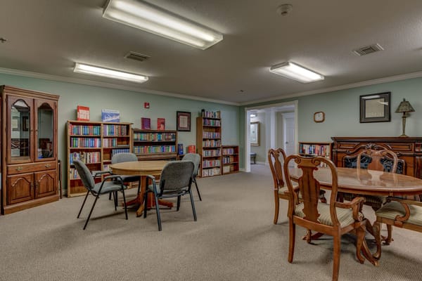 Common area with tables and bookshelves