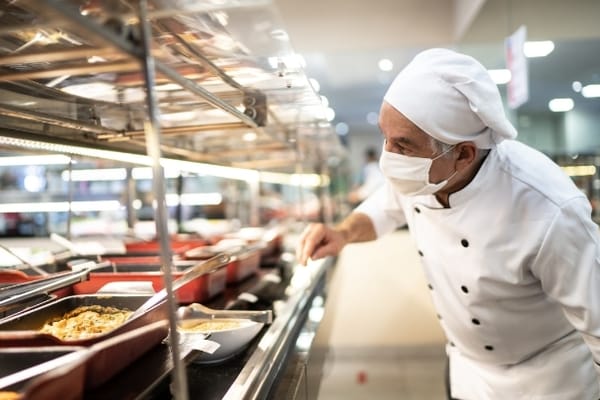 Chef preparing food in the dining area