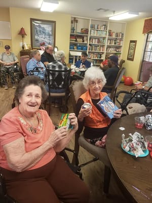 Residents enjoying snacks and activities in a common area