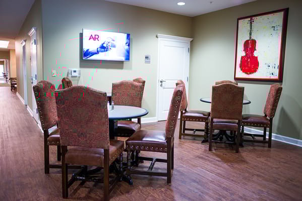 Common area with seating and television
