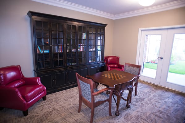 Cozy common area with chairs and a chess table
