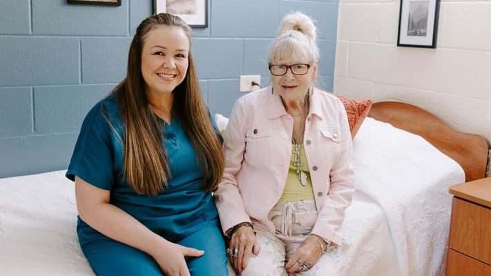 Staff member with resident in a cozy room