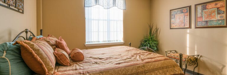 A well-decorated resident bedroom with floral accents