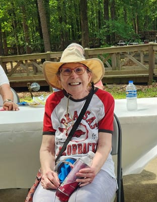 Resident smiling outdoors in a casual setting