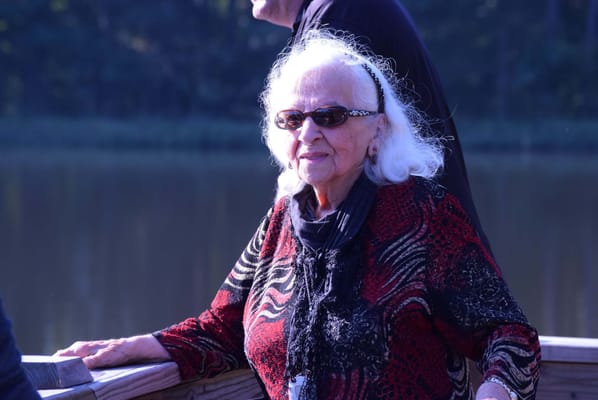 Resident enjoying the outdoor area by a lake