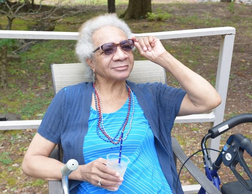Senior resident enjoying the outdoors with sunglasses