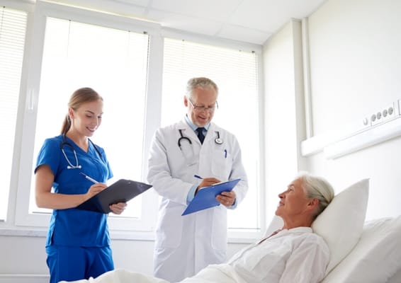 Medical staff attending to a resident in a care facility