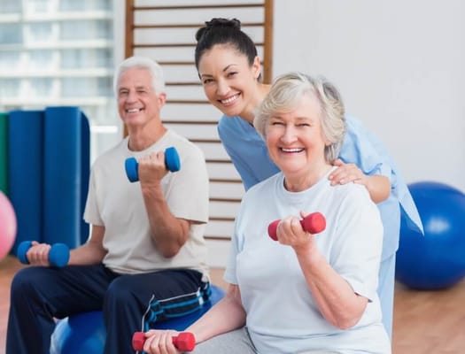 Residents and staff engaging in a fitness class