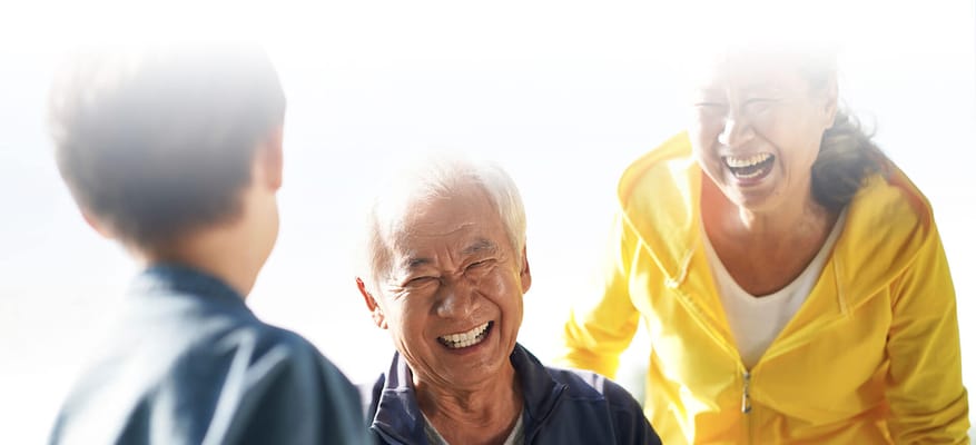 Seniors enjoying laughter together in a cheerful setting