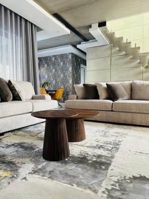 Modern lounge area with sofas and a decorative table
