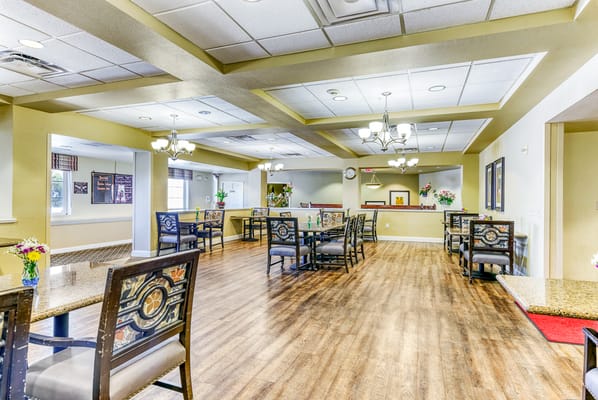 Dining area with tables and chairs in a well-lit space