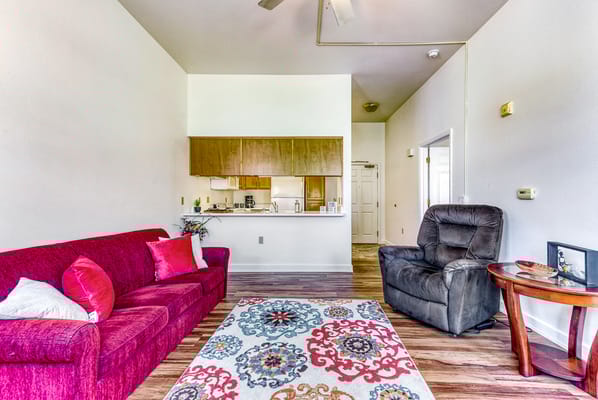 Bright interior living space with seating and kitchen