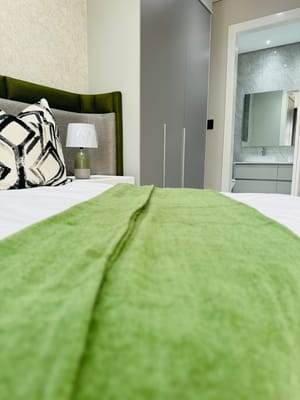 A well-decorated resident room featuring a comfy bed