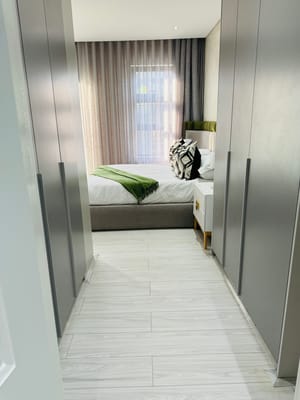 Modern private resident room with bed and wardrobe