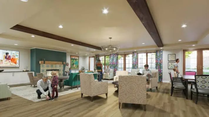 Residents enjoying a common area with family interaction