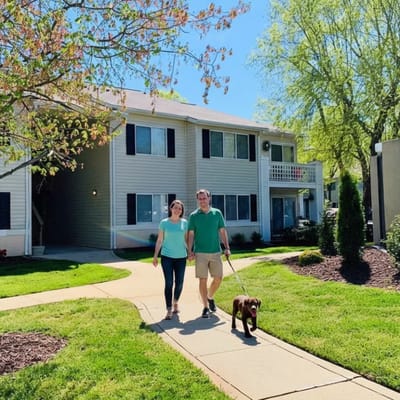 Residents walking a dog outside the facility